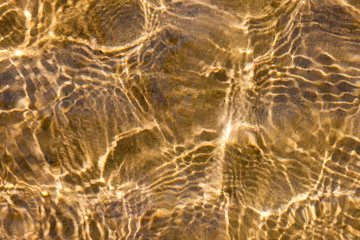 Sunny Water Ripples over Sand